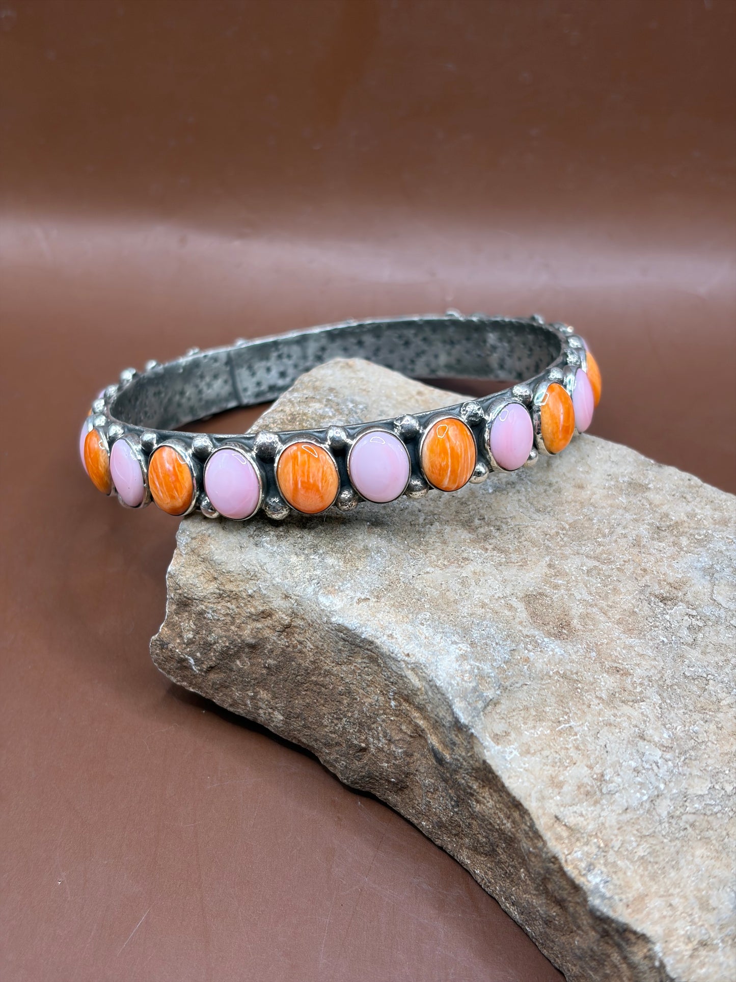 Pink conch and orange spiny Bangle
